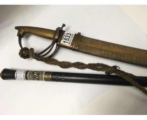 A sword stick and an Indian dress sword with engraved blade