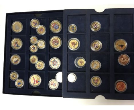 A box of mixed enamel coins