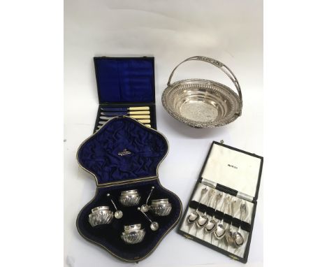 A cased Birmingham silver salt set, a set of Boy Scout teaspoons and a silver plated swing handle basket