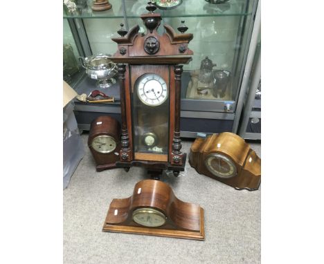 An eight day mahogany cased wall clock plus three mantle clocks (4).