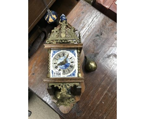 A Dutch delft and oak wall clock