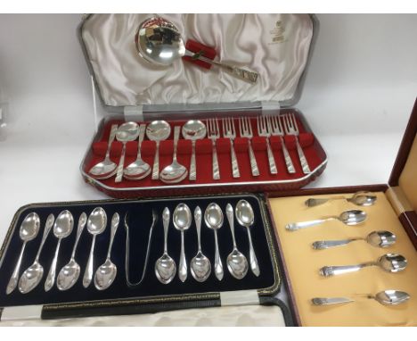 Three cased sets of cutlery including silver tea spoons, Viners dessert forks and spoons etc.