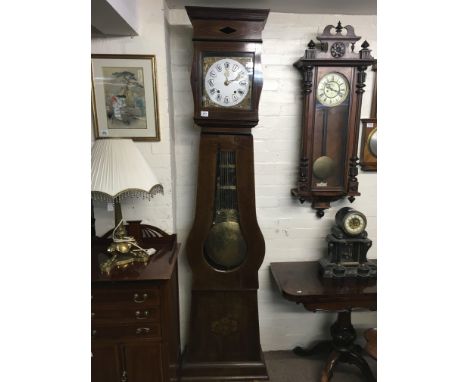 A Quality Swiss Early 19th Century Comtoise clock cirica 1815 with an enamel dial and large visible brass pendulum.