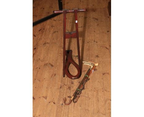 Three horn hunting crops including one silver collared 1934 and a boot jack.