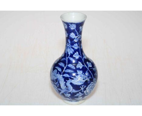 19th Century Chinse blue and white vase decorated with dragons and floral design with Kangxi four-character mark to base, 19c