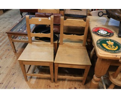 Set of four light elm kitchen chairs.