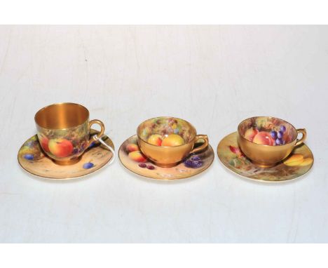 Three Royal Worcester painted fruit cups and saucers by various artists.