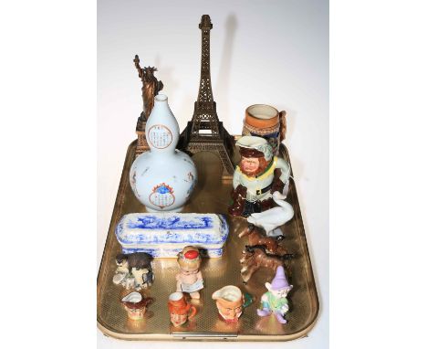 Chinese double gourd vase, Eiffel Tower and Statue of Liberty models, toby jug, Border Fine Arts otter etc.