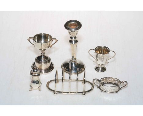 Collection of six small silver items including toast rack and candlestick.