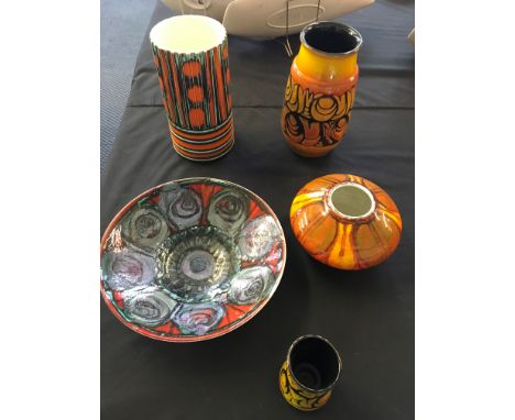 A selection of Poole pottery to include a small vase and bowls.