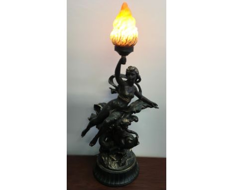 A bronzed finished light fitting of a nymph figure holding flame with cherub, height 94.5cm