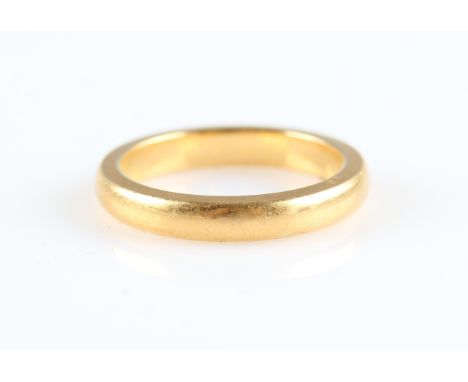 A hallmarked 22ct yellow gold wedding band, ring size K½.