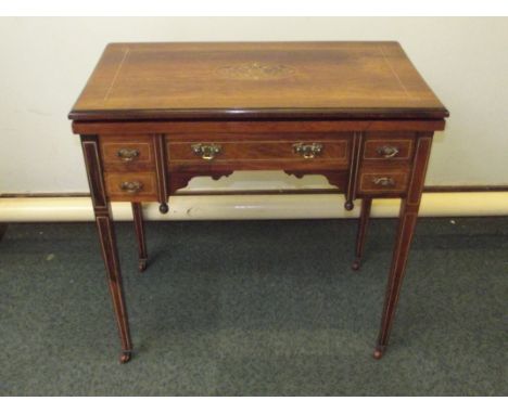 Late Victorian ladies writing desk/games table in rosewood, hinged rectangular fold-over top with marquetry inlay, opening to