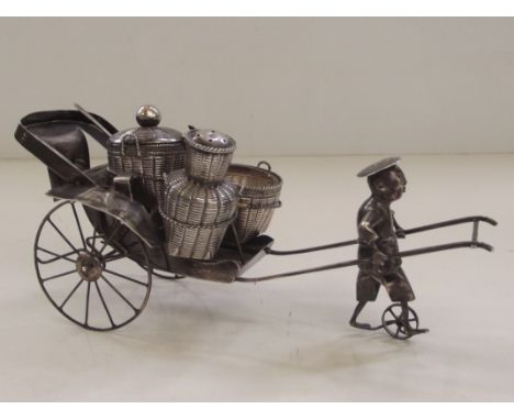 Late 19th/early 20th century Chinese silver cruet set in the form of a street vendor with cart and baskets, markings to under