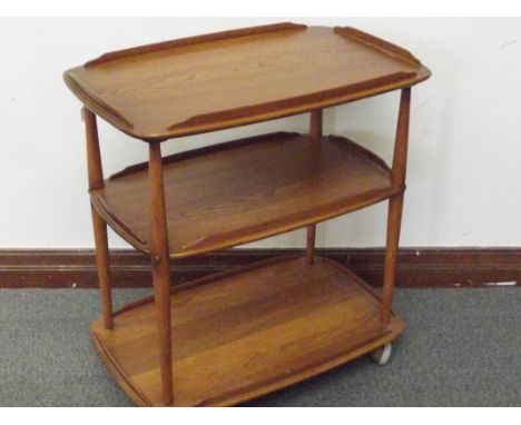 Ercol three tier serving trolley in elm, on castors, height 78cm, width 71cm, depth 45cm