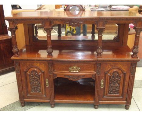 Victorian walnut two tier buffet of small proportion, bow fronted top over four supports with mirrored back, bottom section w