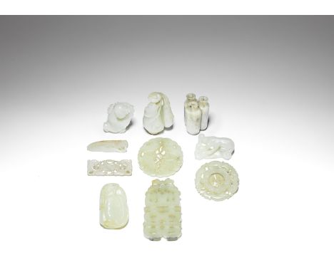 A group of ten small carved jade itemsQing DynastyVariously carved as 'double happiness' characters; a twin bat plaque; a cic