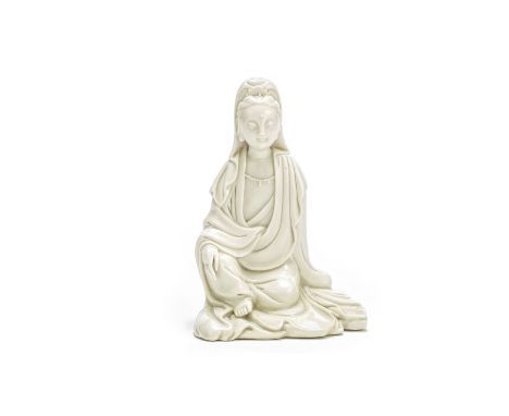 A blanc-de-chine model of GuanyinHe Chaozong seal mark, Qing DynastySeated in lalitasana, a beaded necklace adorning her ches