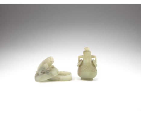 A pale green jade 'Buddhist lion and cub' box and cover and an archaistic pale green jade vase and cover, huQing DynastyThe b
