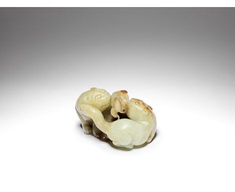 A pale green and russet jade carving 'cats and butterfly' carving18th centuryModelled as two seated felines, turned to face e