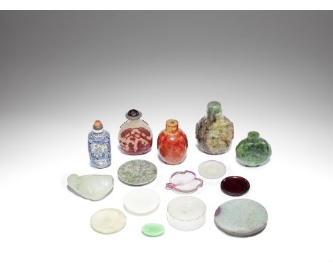 A small collection of snuff bottles and dishes and a jade carvingQing Dynasty and laterComprising: a mottled pale green, mush