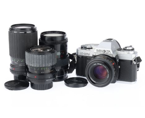 comprising a Minolta X-300, silver, body G, not powering up, shutter not firing, with a MD f/1.7 50mm lens, barrel VG, optics