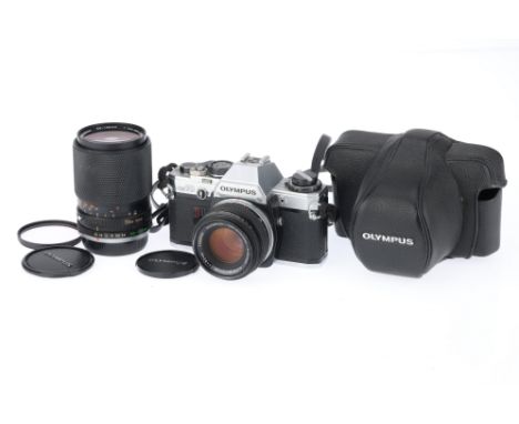 comprising an OM10 body, silver, VG, shutter works, metering responds to light, with a Zuiko f/1.8 50mm lens, barrel F-G, min