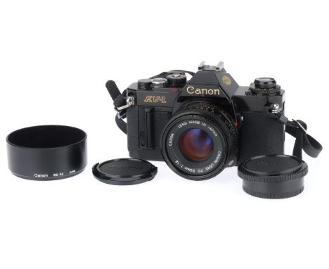 black, body VG, shutter works, metering responds to light, with a FD f/1.8 50mm lens, barrel G, optics F-G.