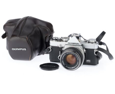 silver, serial number 1079471, body VG, shutter works, meter responds to light, with a Zuiko f/1.8 50mm lens, barrel VG, opti