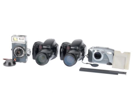 to include a pair of Olympus IS-3000 35mm automatic cameras, one powers up, takes a shot, does not autofocus, the other does 
