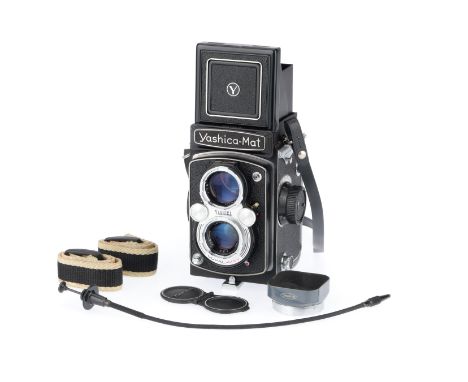 black, body VG, shutter works, iris works, controls are smooth, optics have light fungus, comes with lens hood, caps and cabl