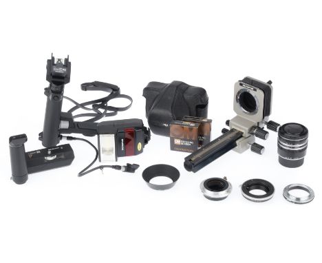 to include oM extension tubes, lens adapters, focusing screens, an auto-bellows, a flash extender arm, winder 2, camera case.