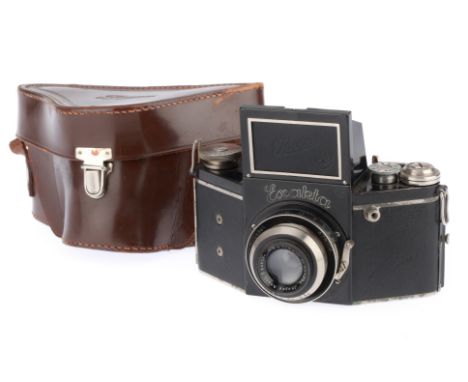 black, body G, shutter working but speeds not verified, advance works, with an Ihagee Exaktar f/3.5 7.5cm lens, barrel G, iri