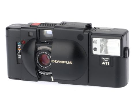 black, serial number 3858033, body G, shutter works, metering responds to light, rangefinder patch clear, A11 flash working.
