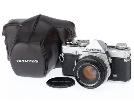 silver, serial number 1456920, body G, small rub mark to top right, shutter works, meter responds to light, with a Zuiko f/1.