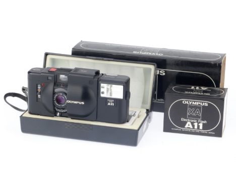 black, body G, shutter and advance work, rangefinder patch works, appears to meter correctly, with A11 flash, in maker's pres