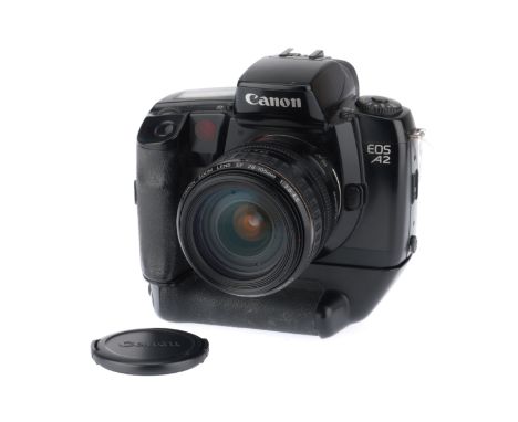 in G used condition, working at time of auction, together with a Canon 28-105mm USM camera lens, body G, optics P-F, some hea