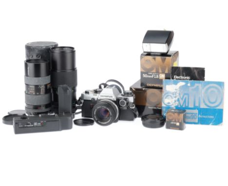 comprising OM-10 serial number 2336537, body G, shutter works, metering appears to work, with manual adapter, with f/1.8 50mm