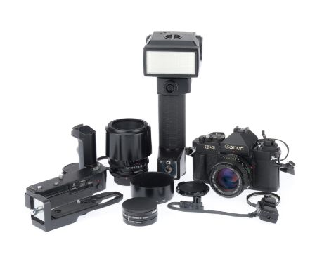 black, body VG, shutter working, meter responds to light, with a f/1.4 50mm lens, barrel VG, optics G, a Tamron f/2.5 90mm wi