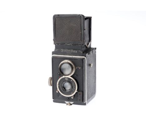 black, serial number 75996, body F-G, shutter works, focuses, iris works, optics have light haze.