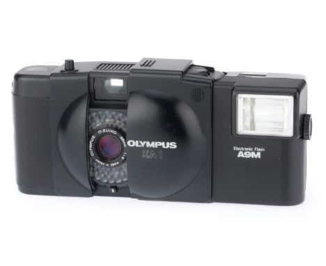 black, body G, shutter works, meter appears to respond to light, with A11 flash, untested.