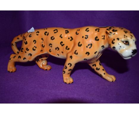 A ceramic figure of an African cat possibly Cheetah by Beswick