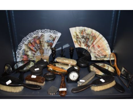 An assortment of dressing table mirrors, fans, glove stretchers,hallmarked brush, candle stick holders and more.