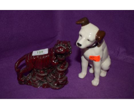 A ceramic figure of a dog in the HMV style and Chinese tiger