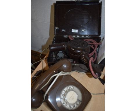A vintage bakelite Ormond E1022 hairdryer in original bakelite box and a rotary dial BT telephone.
