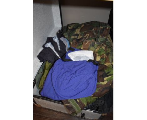 A selection camouflage clothing and similar in metal trunk.