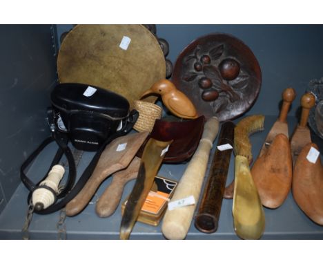 An assortment of vintage items including tambourine, Rank Aldis camera, butter paddles, shoe horns and ceramic toilet flush p