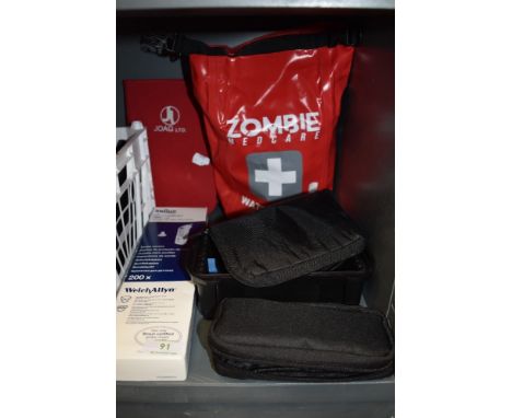 A selection of medical equipment including a waterproof first aid kit and similar.