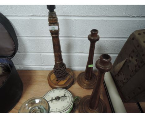 Two antique wooden candle sticks, stamped JBM to underside,a lamp base with inlaid detailing to base, and a Salter weighing s