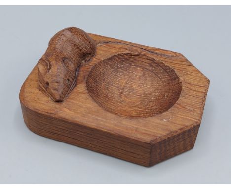 A Robert Mouseman Thompson oak pin tray, decorated with a carved mouse, 10cms long 